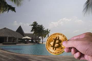 Wall Mural - Hand paying with bitcoin in a luxury resort