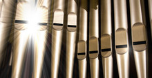 Old Organ Pipes With A Strong Flash Of Light