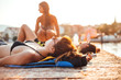 © Dimitrije Tanaskovic/Stocksy - Group of friends by the sea