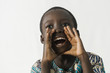 African boy shouting and crying out loud, isolated on white