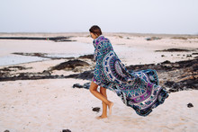 Woman Walking On The Beach With A Towel Mandala