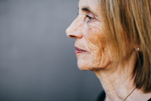 Profile Portrait Of A Wrinkled Senior Woman.