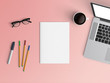 Modern office desk workplace with notebook, coffee cup, blank paper, pen and smartphone copy space on color background. Top view. Flat lay style.