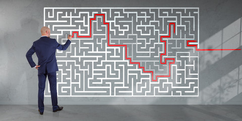 Poster - Businessman searching maze solution on a wall 3D rendering
