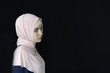 Portrait of a beautiful Muslim woman wearing hijab, isolated