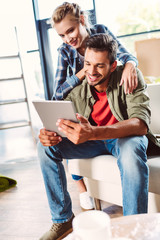 couple using digital tablet