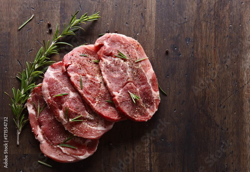 Fotografie, Obraz Pork steak with rosemary and pepper , free space for your text