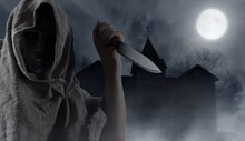Hooded Man With Big Knife .