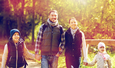 Poster - happy family with backpacks hiking