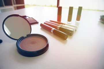 Decorative cosmetics makeup set on white table