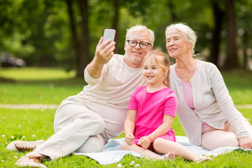 Canvas Print - senior grandparents and granddaughter selfie