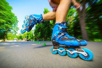 Inline roller skater on a slalom course