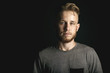 © fotofabrika - portrait of young man above black background