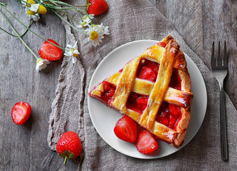 Poster - Plate with delicious piece of strawberry pie on wooden table