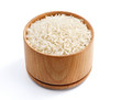 Healthy food. Parboiled rice in wooden bowl isolated on white background. Close up, high resolution product