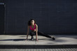 © michela ravasio/Stocksy - Fit woman doing stretching outdoors