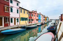Colorful Street With A Canal In Burano