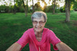 © Rob and Julia Campbell/Stocksy - Portrait of a senior woman smiling outdoors
