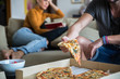 © Jovo Jovanovic/Stocksy - Couple at home having pizza for dinner