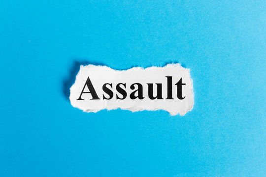 Assault text on paper. Word Assault on a piece of paper. Concept Image.