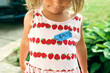 © Maria Manco/Stocksy - little girl with name tag in childs handwriting