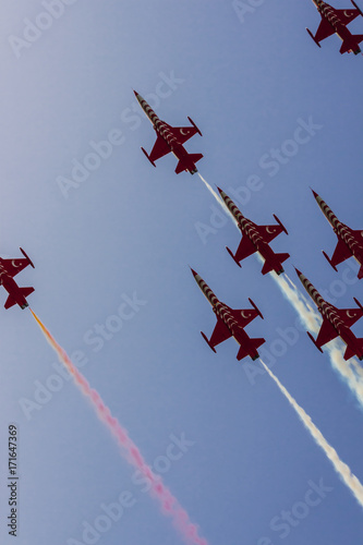 Fotografie, Obraz The turkish acrobatic aviation squadron is flying over Izmir (Turkey) celebrating the 9th september day