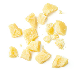 Wall Mural - Parmesan cheese pieces on white background. Italian cheese slices. Top view.