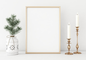 Wall Mural - Vertical poster mock up with golden frame, candles and pine branch in vase on white wall background. 3D rendering.