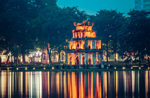 Night View Of The Turtle Tower In Middle Of The Hoan Kiem Lake (Lake Of The Returned Sword) At Historic Centre Of Hanoi In Vietnam