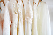 © Jennifer Brister/Stocksy - Rack of wedding dress