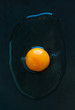 © Jelena Jojic Tomic/Stocksy - Fresh raw egg on a dark background
