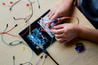© Take A Pix Media, LLC/Stocksy - Asian kid working on an electronic project at home