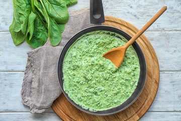 Sticker - Frying pan with spinach dip on table