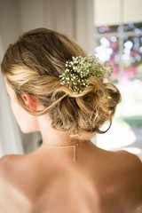 Wall Mural - Close up of bride blond hair with flowers