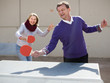 © caftor - mature couple playing table tennis outdoors