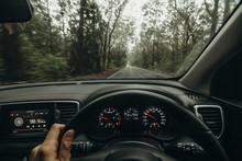Inside View Of Car Steering Wheel While Driving Across Australian Road.