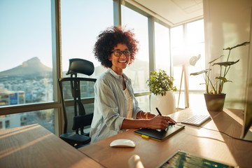 Wall Mural - Young woman at her creative workplace