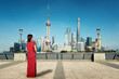 Asian young woman in Chinese traditional dress travel in Shanghai, China..