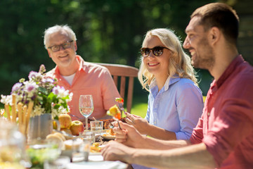 Poster - happy family having dinner or summer garden party