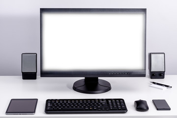 Wall Mural - Blank white pc monitor on desktop in organized workplace.