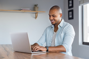 Man working on laptop at home