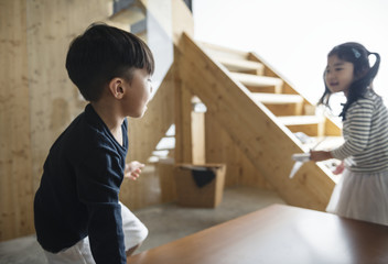 Wall Mural - Japanese sibling playing together happiness