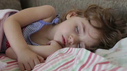 baby sleeps in bed