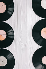 music records and notes on wooden background