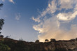 © mishamif - Partly cloudy. Beautiful sky. Landscape with the sky. Patterns from the clouds. Summer. Trees on a cliff. Beauty of the sky.