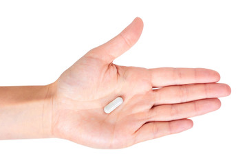 Capsules pills in hand isolated on white background