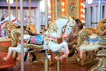 Children's Carousel With Horses At The Festival