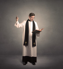 young priest in giving his blessing