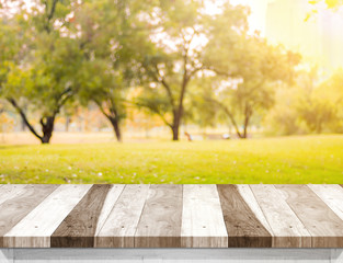 Aufkleber - Empty old rustic wood plank table top with blur forest tree with sunlight,Autumn fall backgorund,Mock up for display or montage of product,banner for advertise on online.