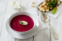 Beet Cream Soup With Sour Cream And Croutons And A White Plate. Rustic Style, Selective Focus.